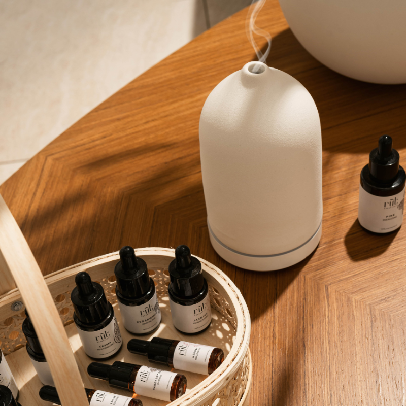 essential oils and white ceramic diffuser